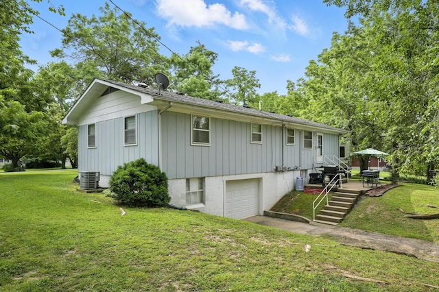 601 Linzee Blvd, Pierce City, MO 65723 - view of home's exterior with board and batten siding, an attached garage, and a yard
