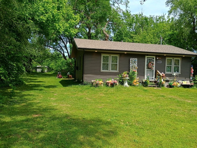 231 W School St, Everton, MO 65646 - view of front of property featuring a front yard and roof with shingles