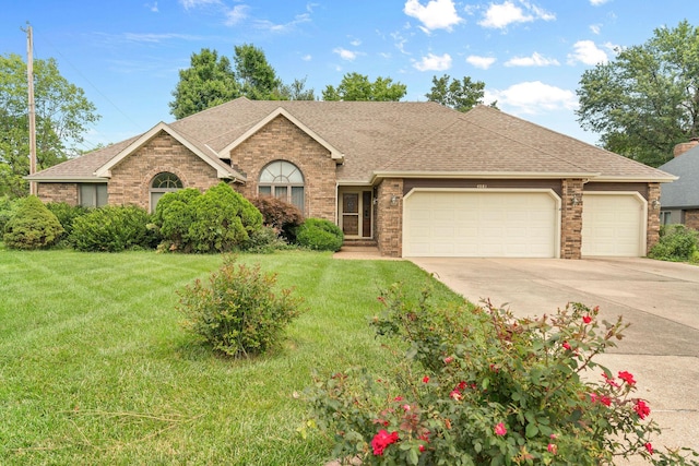 4081 E Kingsbury St, Springfield, MO 65809 - ranch-style house featuring driveway, brick siding, an attached garage, a shingled roof, and a front yard