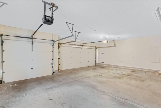 4081 E Kingsbury St, Springfield, MO 65809 - garage featuring a garage door opener
