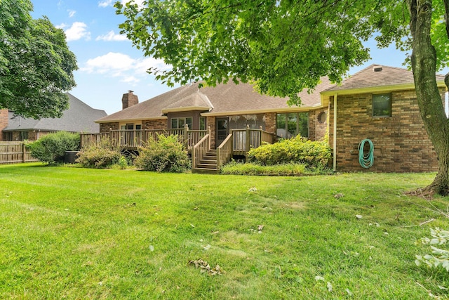 4081 E Kingsbury St, Springfield, MO 65809 - back of property featuring brick siding, a wooden deck, and a chimney