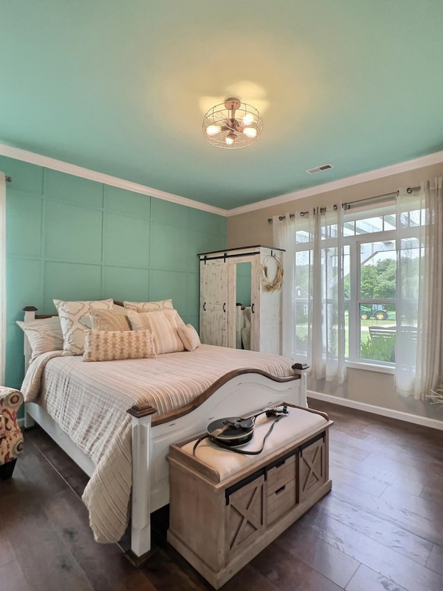 556 Carter 309, Van Buren, MO 63965 - bedroom featuring dark wood-type flooring and ornamental molding