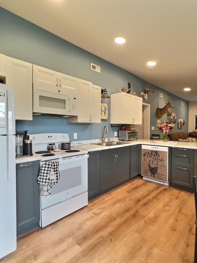 556 Carter 309, Van Buren, MO 63965 - kitchen featuring white appliances, gray cabinets, light countertops, recessed lighting, and light wood-style flooring