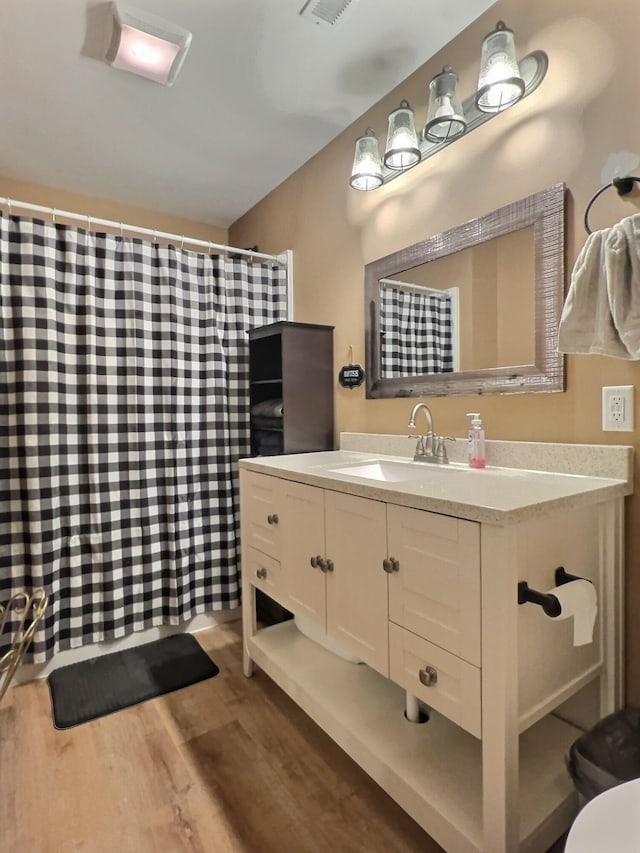556 Carter 309, Van Buren, MO 63965 - full bathroom featuring wood finished floors, vanity, and curtained shower