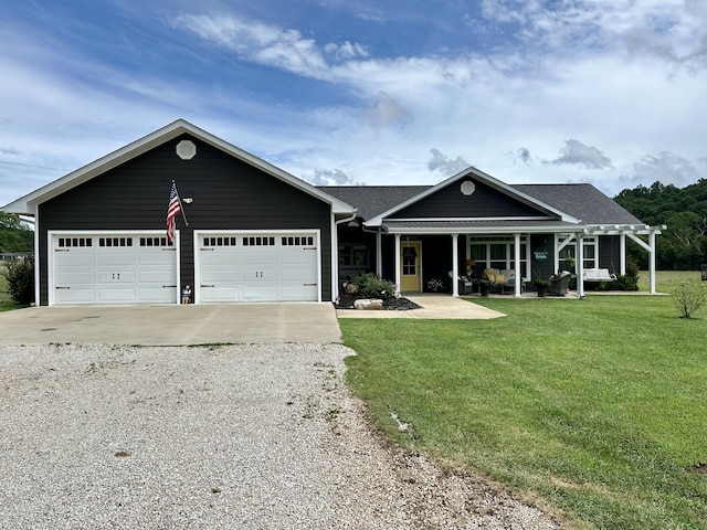 556 Carter 309, Van Buren, MO 63965 - ranch-style home with driveway, a front yard, covered porch, and an attached garage