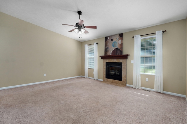 5834 Geranium Ln, Battlefield, MO 65619 - unfurnished living room with a ceiling fan, carpet flooring, and a tile fireplace