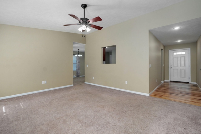 5834 Geranium Ln, Battlefield, MO 65619 - unfurnished living room featuring carpet floors, a ceiling fan, and a chandelier