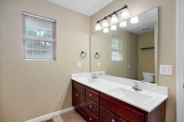5834 Geranium Ln, Battlefield, MO 65619 - full bath featuring healthy amount of natural light, double vanity, and tile patterned flooring