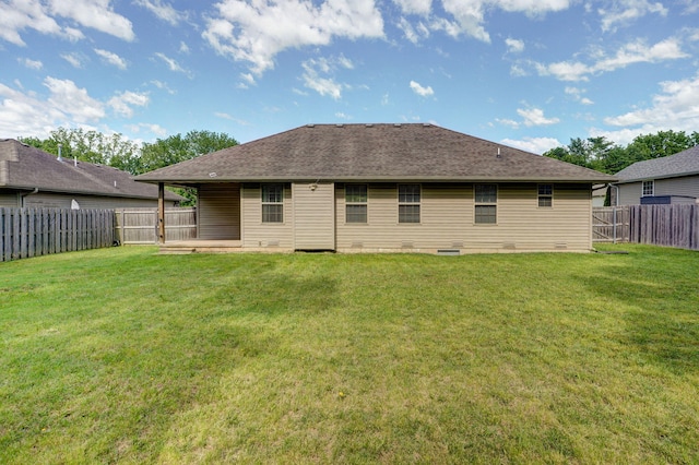 5834 Geranium Ln, Battlefield, MO 65619 - back of property with a fenced backyard, a shingled roof, and a patio area