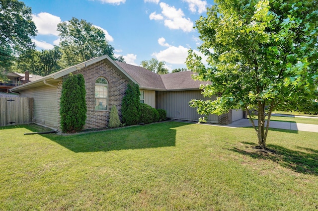 5834 Geranium Ln, Battlefield, MO 65619 - view of front of property with brick siding, concrete driveway, and an attached garage