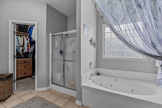 701 E Bayshore Dr, Ozark, MO 65721 - bathroom with a shower stall, a whirlpool tub, a walk in closet, and tile patterned floors
