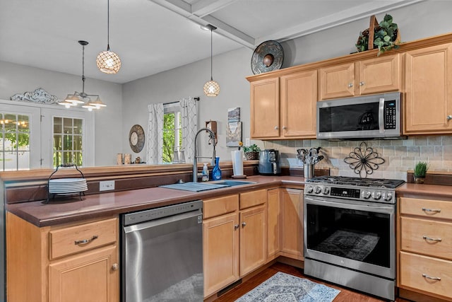 701 E Bayshore Dr, Ozark, MO 65721 - kitchen featuring appliances with stainless steel finishes, light brown cabinetry, and a peninsula