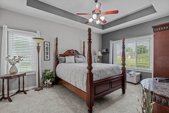 701 E Bayshore Dr, Ozark, MO 65721 - bedroom featuring light carpet, a tray ceiling, and a ceiling fan