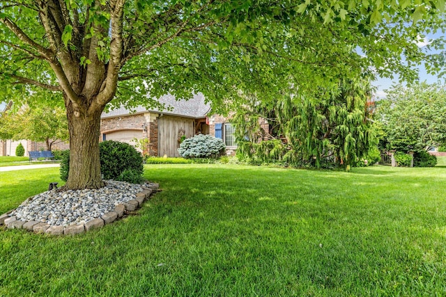701 E Bayshore Dr, Ozark, MO 65721 - view of green lawn featuring an attached garage