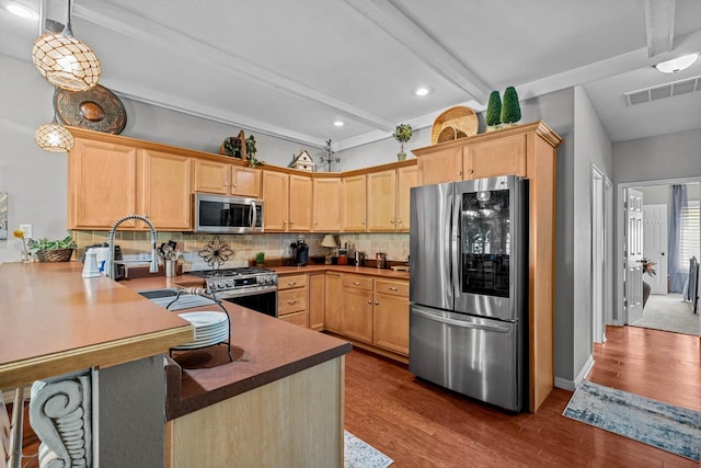 701 E Bayshore Dr, Ozark, MO 65721 - kitchen featuring stainless steel appliances, a peninsula, light brown cabinetry, beam ceiling, and dark wood-style flooring