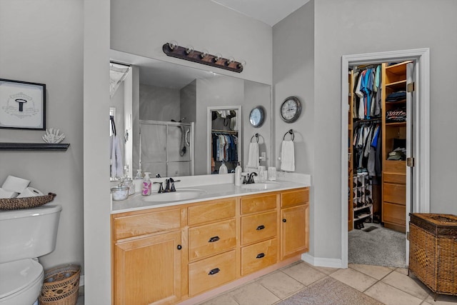 701 E Bayshore Dr, Ozark, MO 65721 - full bathroom with a walk in closet, tile patterned floors, double vanity, and a shower stall