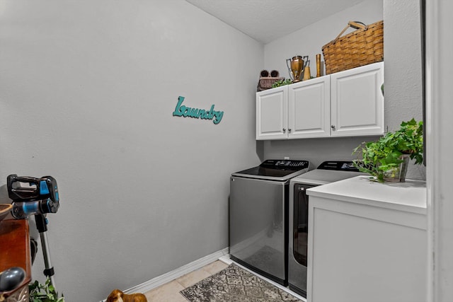 701 E Bayshore Dr, Ozark, MO 65721 - laundry area featuring cabinet space, washer and dryer, and light tile patterned flooring
