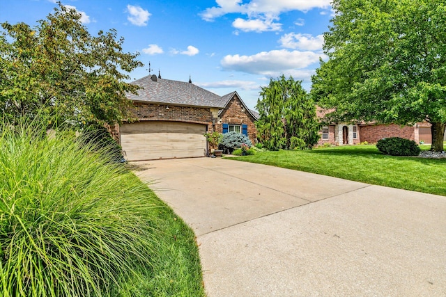 701 E Bayshore Dr, Ozark, MO 65721 - view of front of house with brick siding, a front yard, a garage, driveway, and roof with shingles