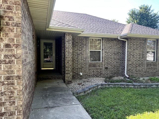 519 N Lynette Ave, Republic, MO 65738 - property entrance with a shingled roof and brick siding