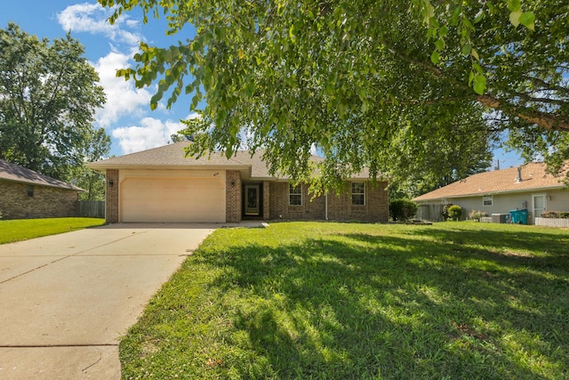 519 N Lynette Ave, Republic, MO 65738 - single story home featuring a garage, concrete driveway, and brick siding