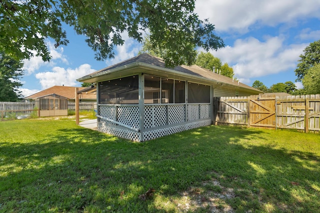 519 N Lynette Ave, Republic, MO 65738 - fenced backyard with a sunroom and a gate