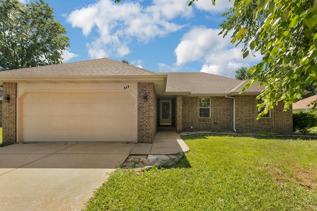 519 N Lynette Ave, Republic, MO 65738 - ranch-style home with brick siding, a garage, and driveway