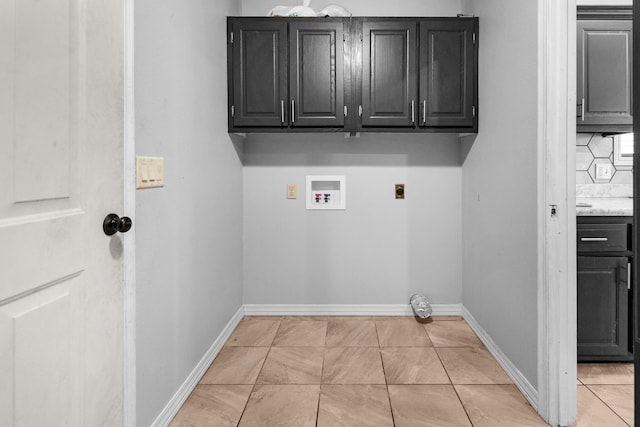 519 N Lynette Ave, Republic, MO 65738 - laundry room featuring electric dryer hookup, hookup for a washing machine, cabinet space, and light tile patterned flooring