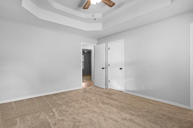 519 N Lynette Ave, Republic, MO 65738 - empty room with carpet floors, a raised ceiling, and a ceiling fan