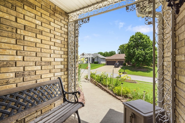 3045 S Palisades Dr, Springfield, MO 65807 - covered porch featuring a lawn