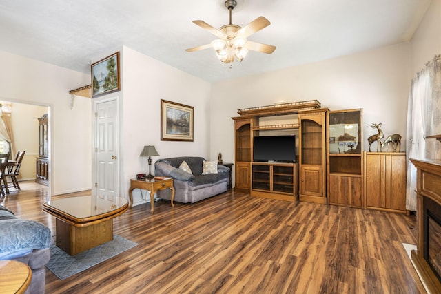 3045 S Palisades Dr, Springfield, MO 65807 - living room with wood finished floors, ceiling fan, and a fireplace