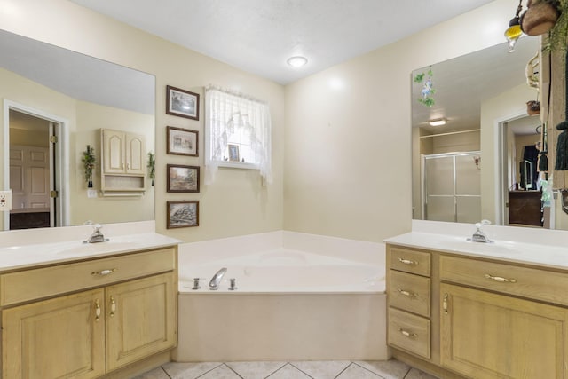 3045 S Palisades Dr, Springfield, MO 65807 - full bathroom featuring a stall shower, two vanities, a garden tub, and tile patterned flooring