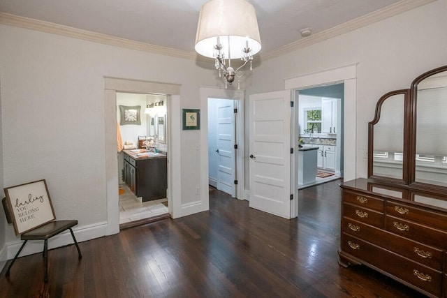 628 W Lynn St, Springfield, MO 65802 - unfurnished dining area with dark wood-style flooring, ornamental molding, and a chandelier