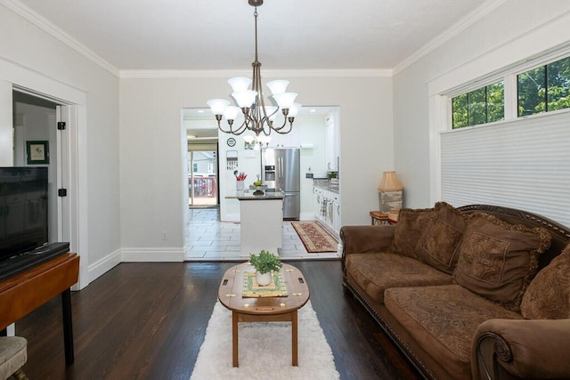 628 W Lynn St, Springfield, MO 65802 - living room featuring a chandelier, dark wood-type flooring, and crown molding