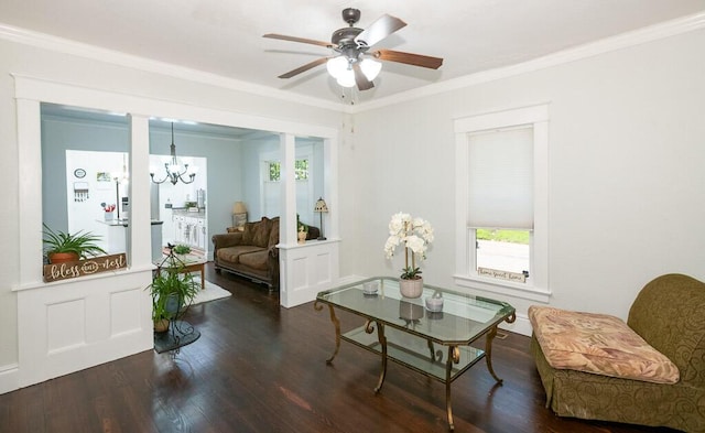 628 W Lynn St, Springfield, MO 65802 - living area featuring wood finished floors, plenty of natural light, ceiling fan, a chandelier, and crown molding