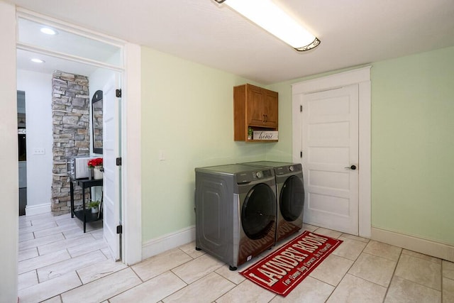 628 W Lynn St, Springfield, MO 65802 - laundry area featuring cabinet space, washer and dryer, light tile patterned floors, and recessed lighting