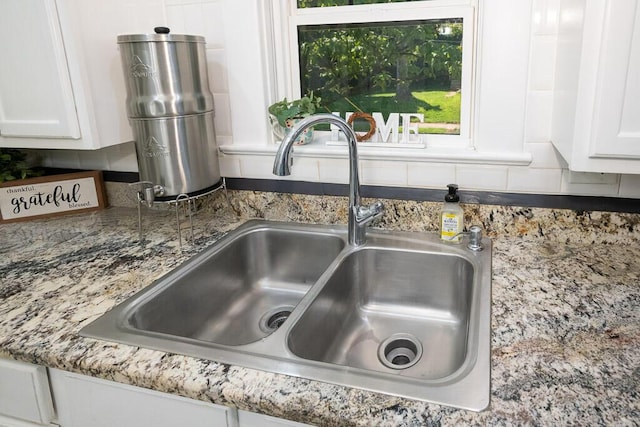 628 W Lynn St, Springfield, MO 65802 - kitchen view of white cabinetry and tasteful backsplash