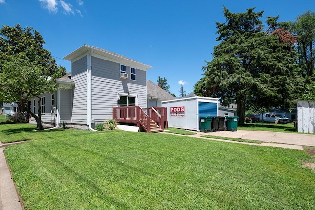 628 W Lynn St, Springfield, MO 65802 - back of property with a deck and a yard
