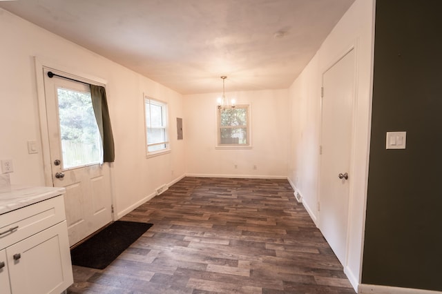1520 E Seminole St, Springfield, MO 65804 - unfurnished dining area featuring a chandelier, healthy amount of natural light, dark wood-style floors, and electric panel