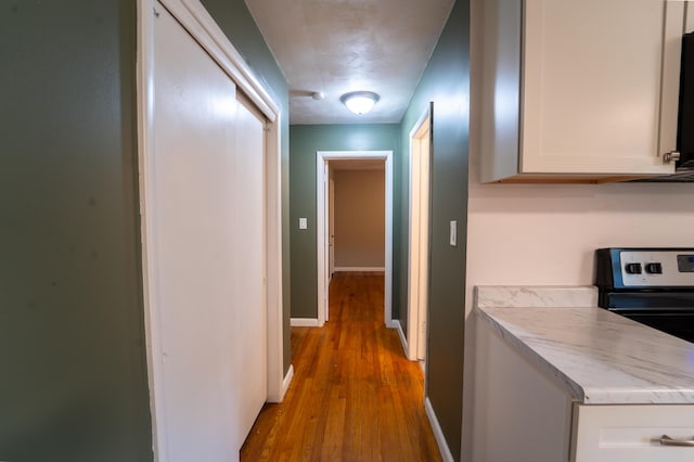 1520 E Seminole St, Springfield, MO 65804 - corridor featuring wood finished floors and baseboards