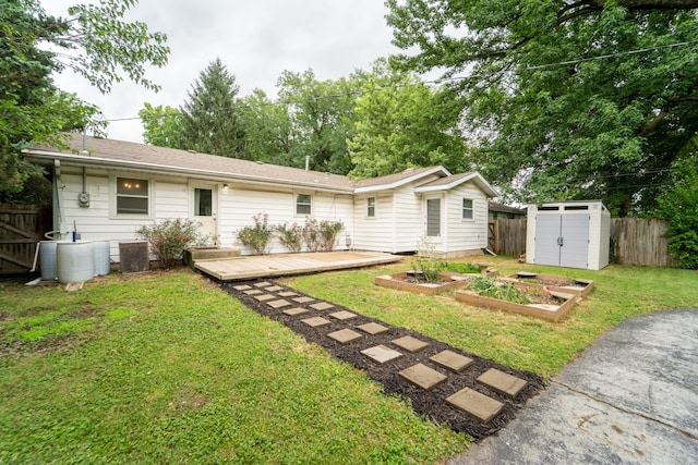1520 E Seminole St, Springfield, MO 65804 - rear view of property featuring a garden, a wooden deck, and a shed