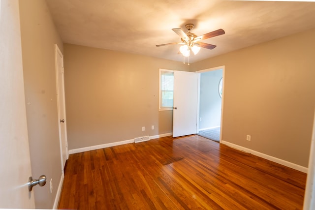 1520 E Seminole St, Springfield, MO 65804 - spare room with ceiling fan and wood finished floors