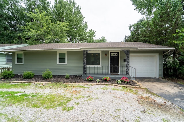 1520 E Seminole St, Springfield, MO 65804 - ranch-style home featuring a porch, an attached garage, and driveway