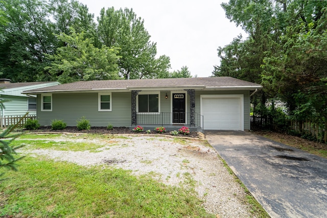 1520 E Seminole St, Springfield, MO 65804 - ranch-style house with an attached garage, covered porch, and concrete driveway