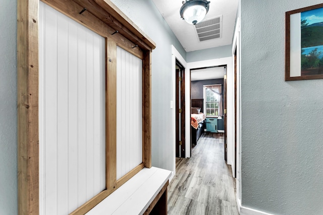 1604 E Sycamore St, Ozark, MO 65721 - hall with a textured wall and wood finished floors