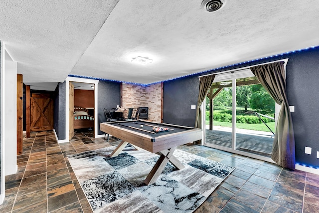 1604 E Sycamore St, Ozark, MO 65721 - rec room with stone tile floors, a textured wall, a textured ceiling, and billiards table