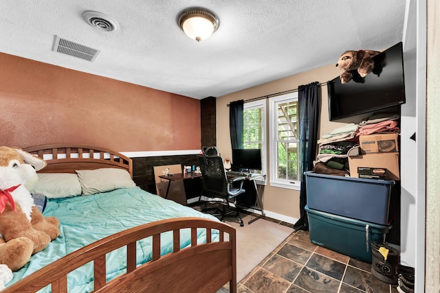 1604 E Sycamore St, Ozark, MO 65721 - bedroom with a textured ceiling and a desk