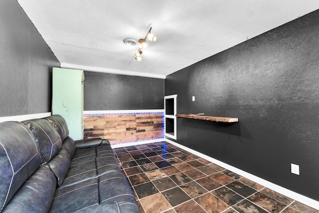 1604 E Sycamore St, Ozark, MO 65721 - unfurnished living room with a textured wall and a textured ceiling