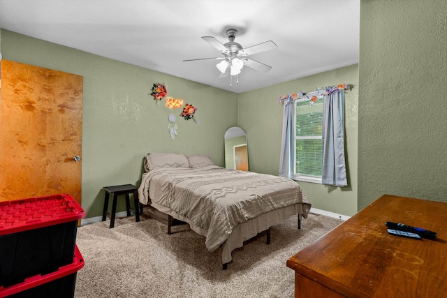 1860 E Division St, Bolivar, MO 65613 - carpeted bedroom with ceiling fan and a textured wall