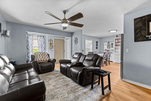 1860 E Division St, Bolivar, MO 65613 - living area with a ceiling fan and light wood finished floors
