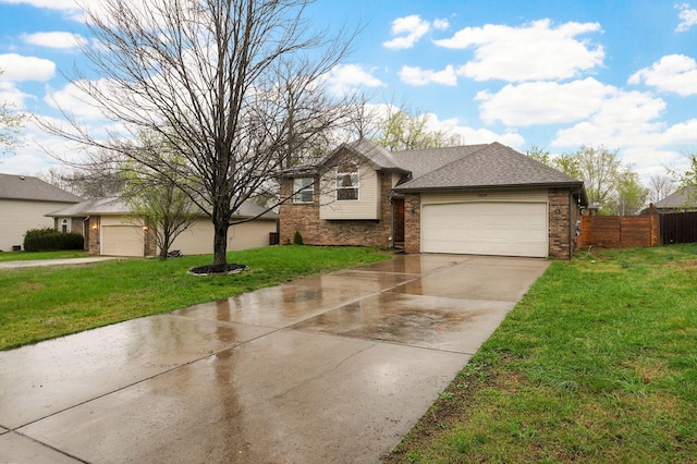 3239 W Erie St, Springfield, MO 65807 - view of front of home with brick siding, a garage, and driveway